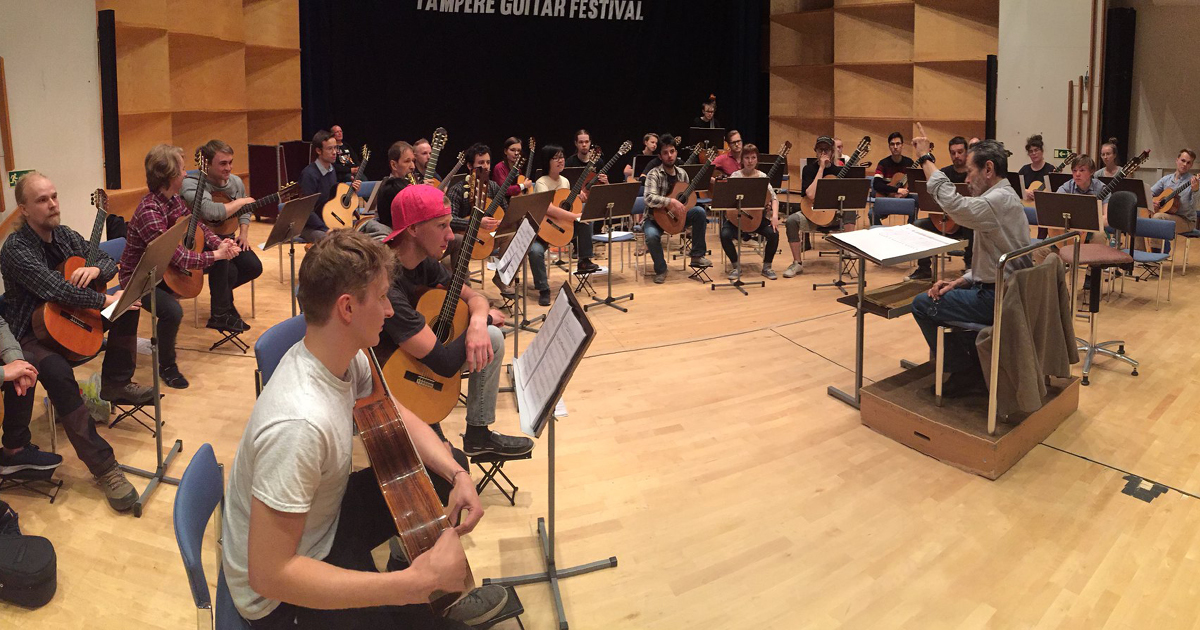 Leo Brouwer is conducting his work with Guitar Orchestra of Finland. Photo: Tomi Tolvanen